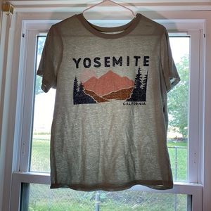 Medium light green t-shirt that is cotton.